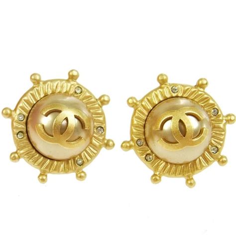 chanel button stud earrings.